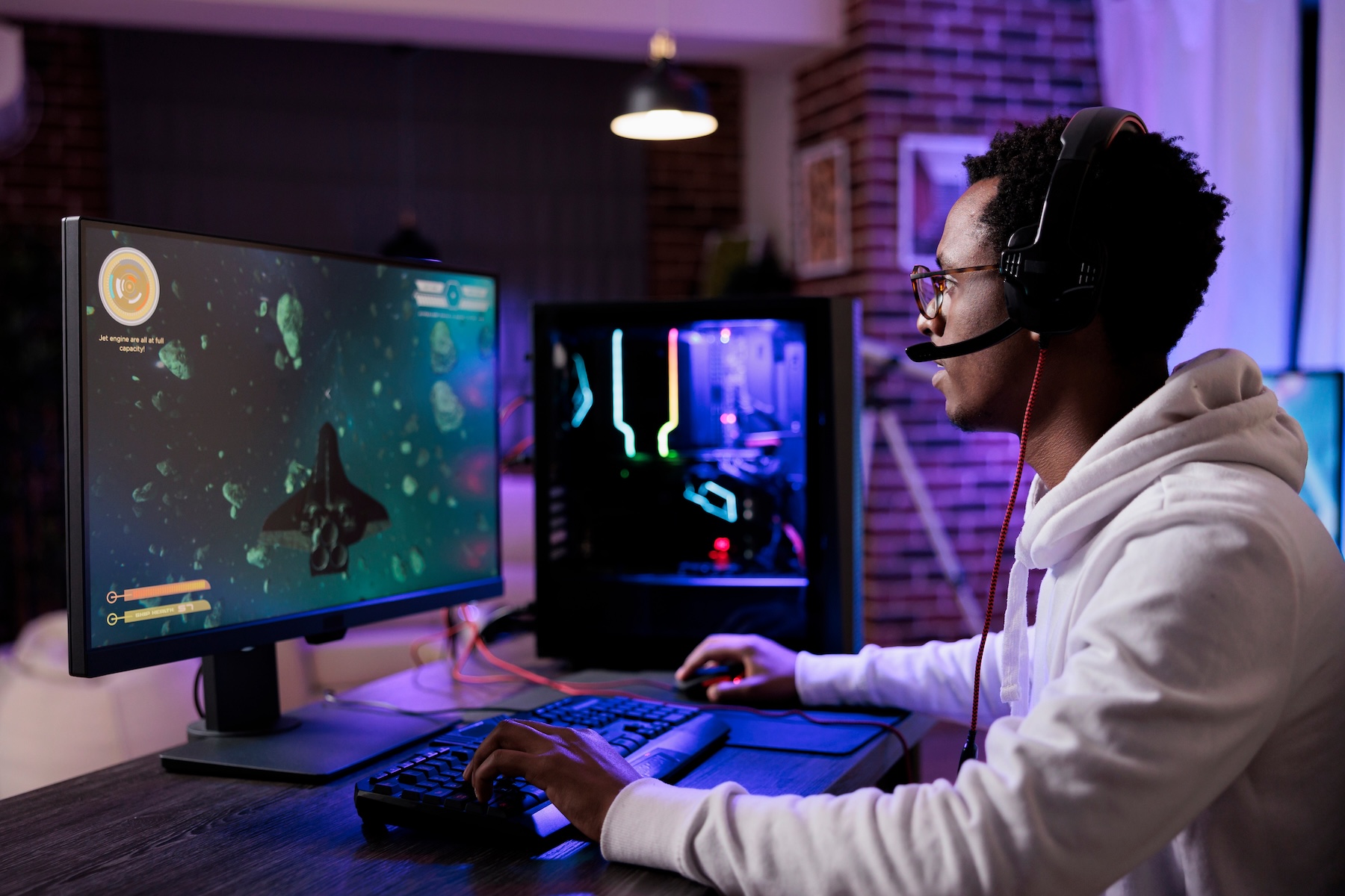 Call-Center5 African American male gamer playing on home PC setup
