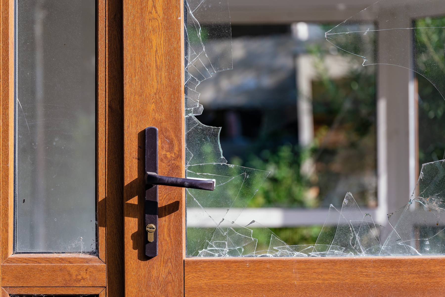 Modern door with handle and broken glass